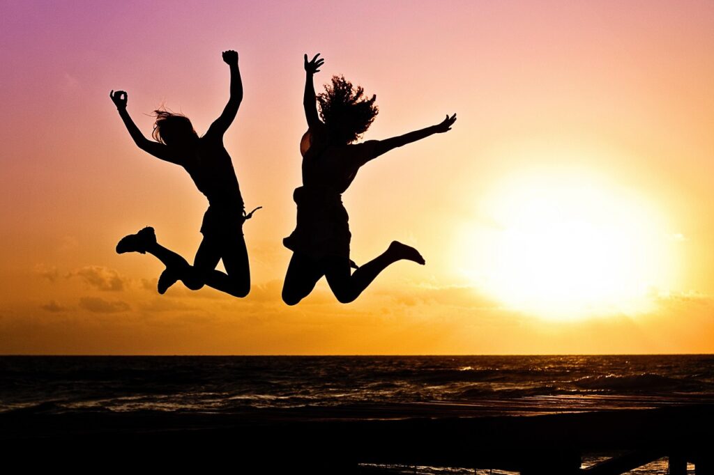 new year background, sunset, beach, silhouettes, nature, jump, jumping, youth, active, happy, pair, girls, young women, people, joy, freedom, seaside, dusk