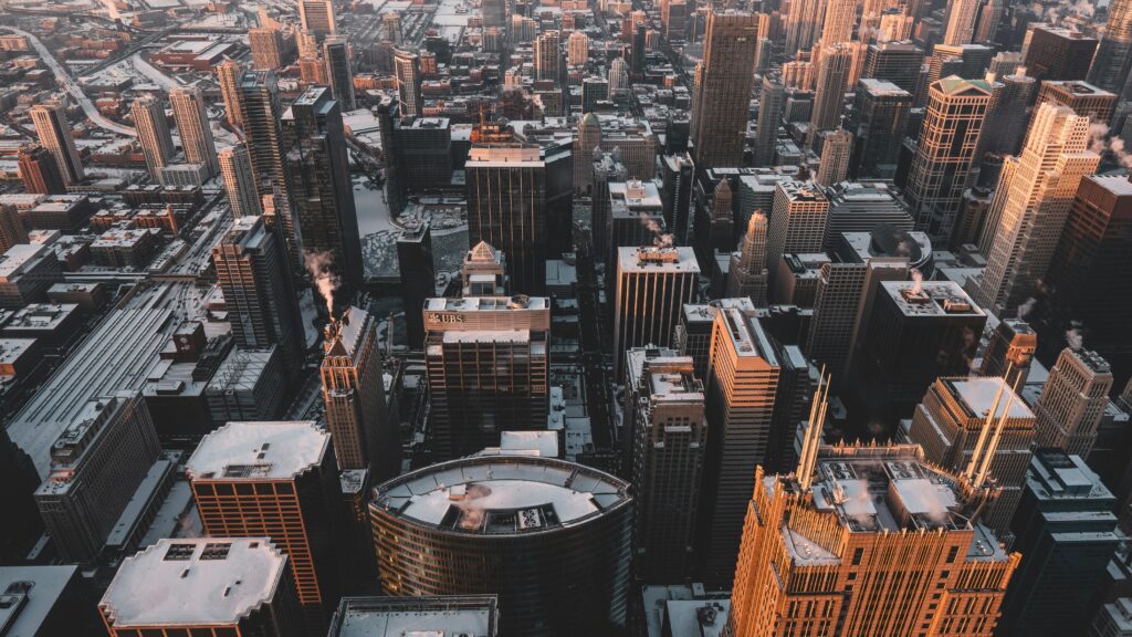 Experience the breathtaking aerial view of Chicago's snow-dusted skyline captured in the evening light.