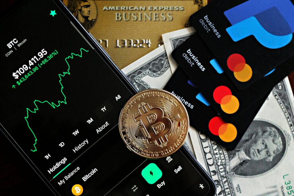 A dynamic image showcasing Bitcoin, credit cards, and financial apps for investment enthusiasts.