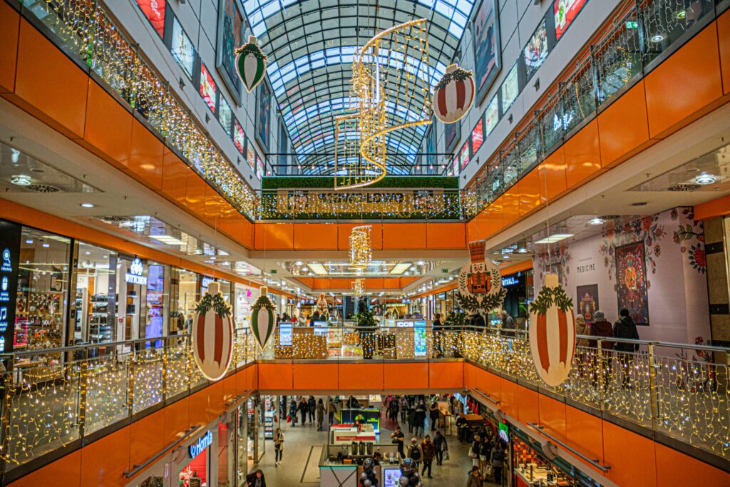 Holiday decorations and festive atmosphere inside a shopping mall.