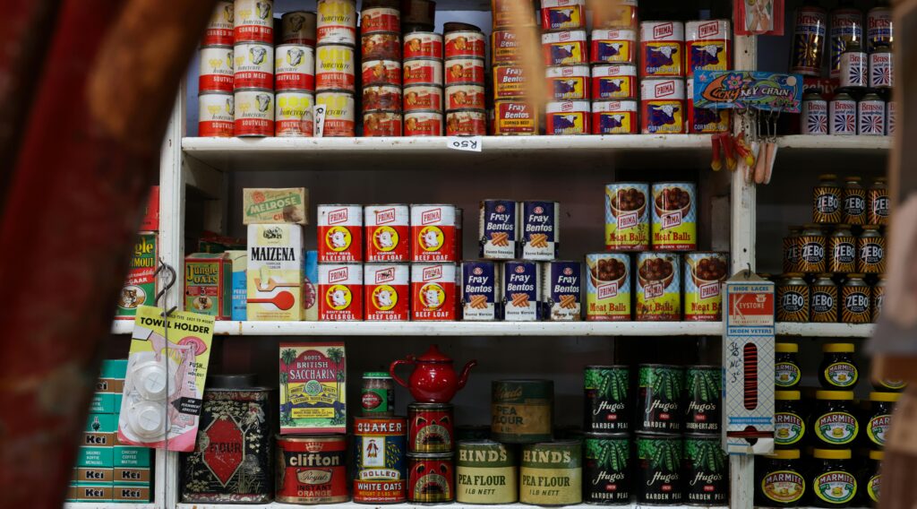 Explore classic canned goods on vintage grocery store shelves, showcasing nostalgic packaging and colors.
